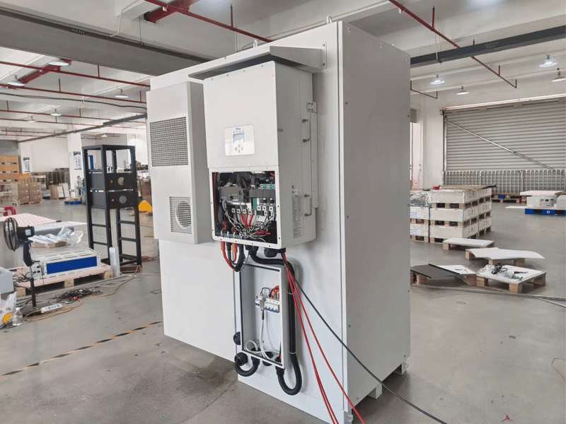 Rakour factory workers assembling 51.2V high voltage LiFePO4 battery modules on production line in Xiamen China