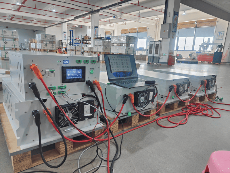 Rakour energy storage system with smart BMS and WIFI remote monitoring displayed on laptop in factory testing environment